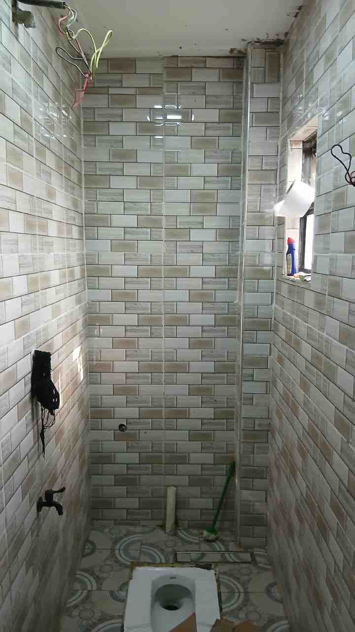 Full Bathroom Remodel — Rough-In to Finish — During — tiling underway
