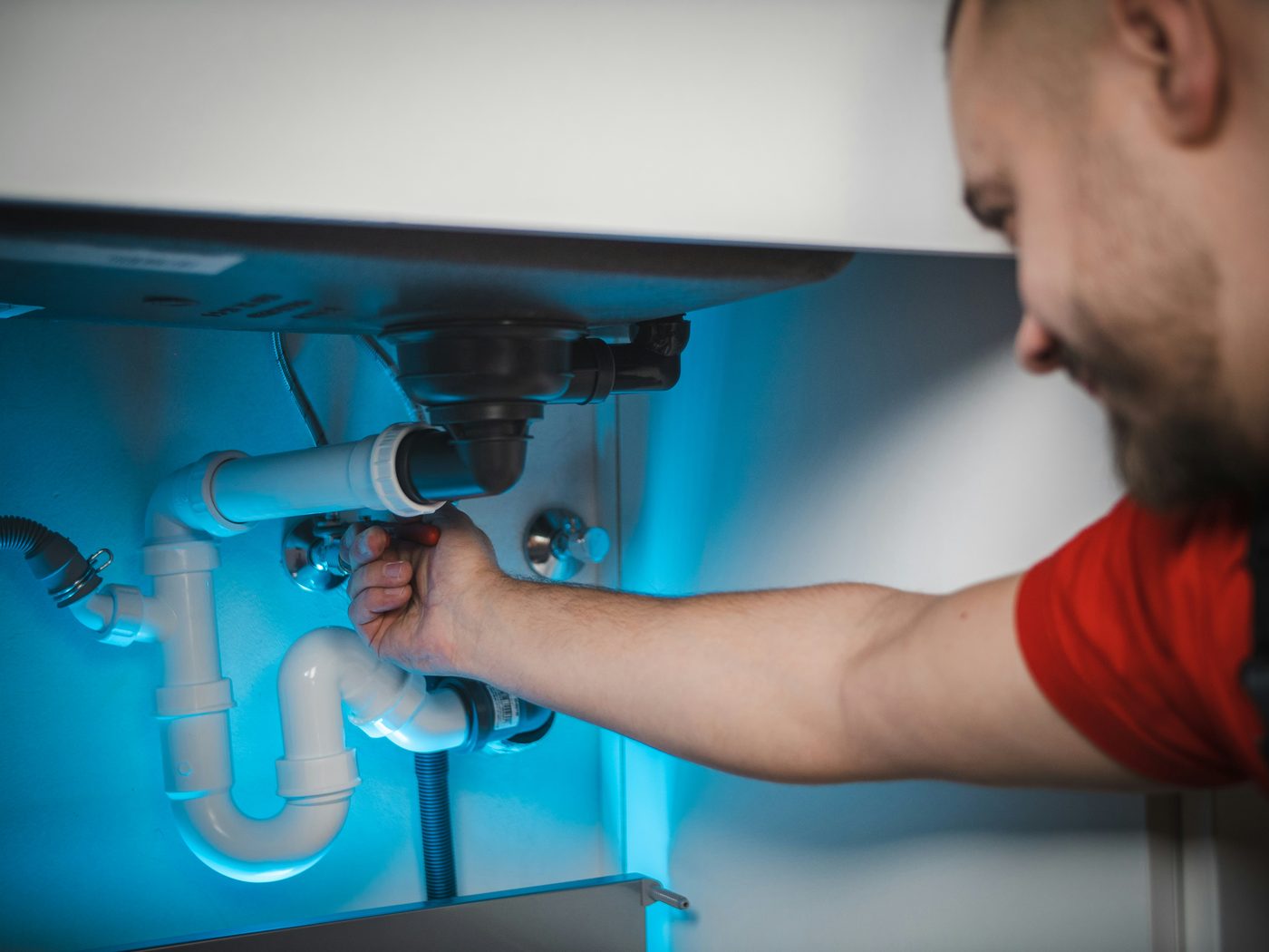 CareMax technician replacing in-wall pipework